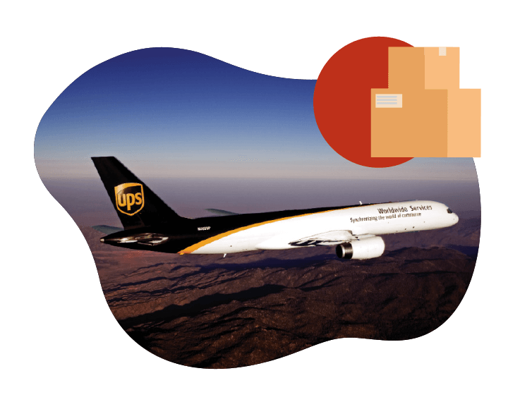 Franchise_About_Carriers_5050_1 A UPS cargo plane soars over a mountainous landscape under a clear sky, embodying the efficiency of Unishippers shipping services. In the top right corner, stacked brown packages symbolize seamless delivery and logistics expertise.