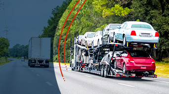 A logistics truck transporting several cars cruises down a tree-lined highway. Another truck is visible ahead, accompanied by a semi-circular gradient overlay and red design lines enhancing the image.