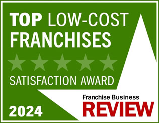 A green graphic proudly announces the Top Low-Cost Franchises Satisfaction Award 2024, graced with a striking five-star design. Franchise Business Review features in vibrant red and black at the bottom right, celebrating excellence in Unishippers Franchise Ownership.