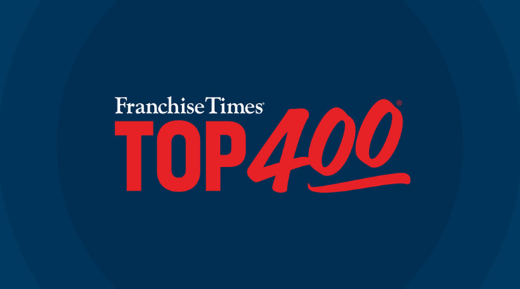 Logo with the words Franchise Times TOP 400 in white and bold red text on a dark blue background, highlighting its recognition as a Top 100 Franchise for Women.