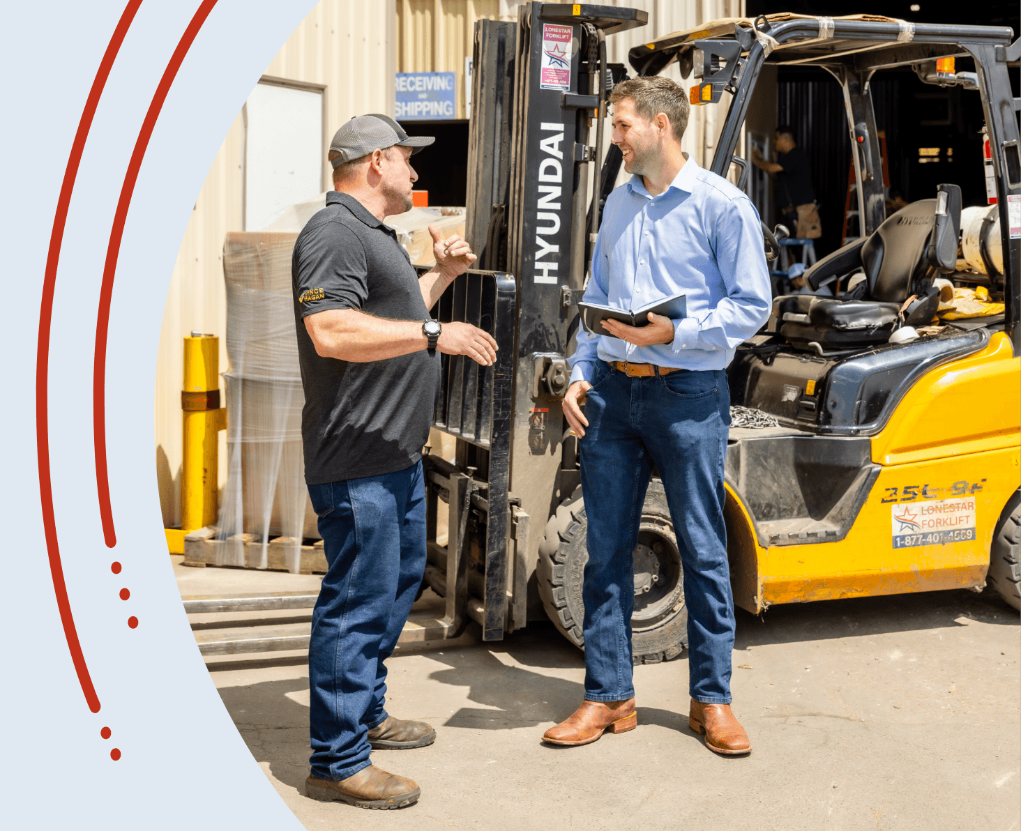 Two men talk outside near a yellow Hyundai forklift—one in a black shirt and cap gestures as the other, in a blue shirt holding a notebook, listens and smiles. Shipping signs and boxes highlight the ongoing logistics industry growth behind them.